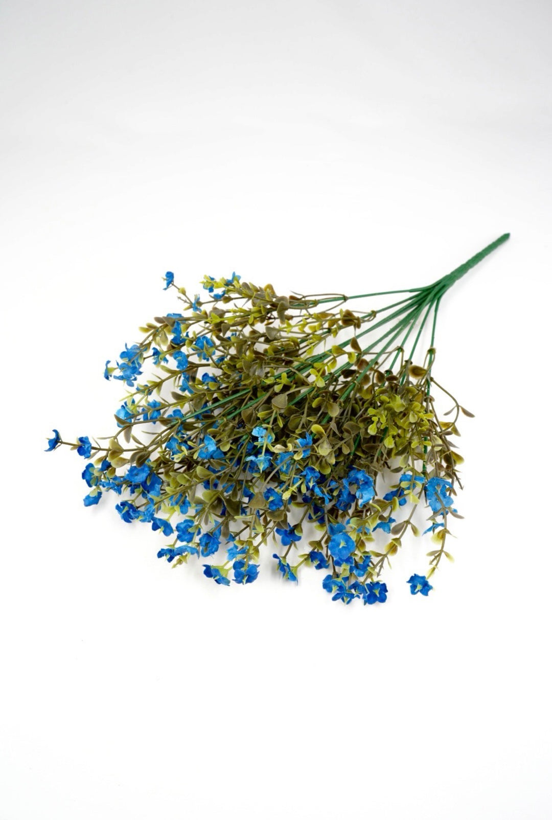 Blue filler flowers and boxwood greenery