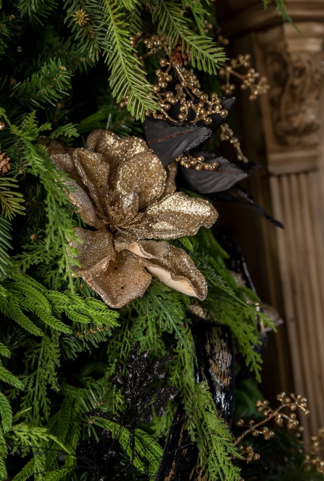 green tree with gold ribbon and berries