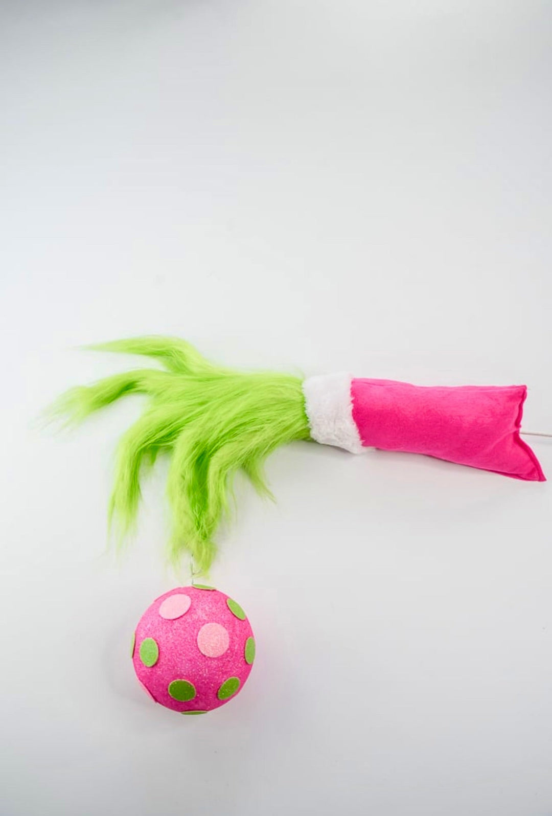 Green fluffy monster hand holding pink ornament - Greenery MarketPicksGM2116PKGN