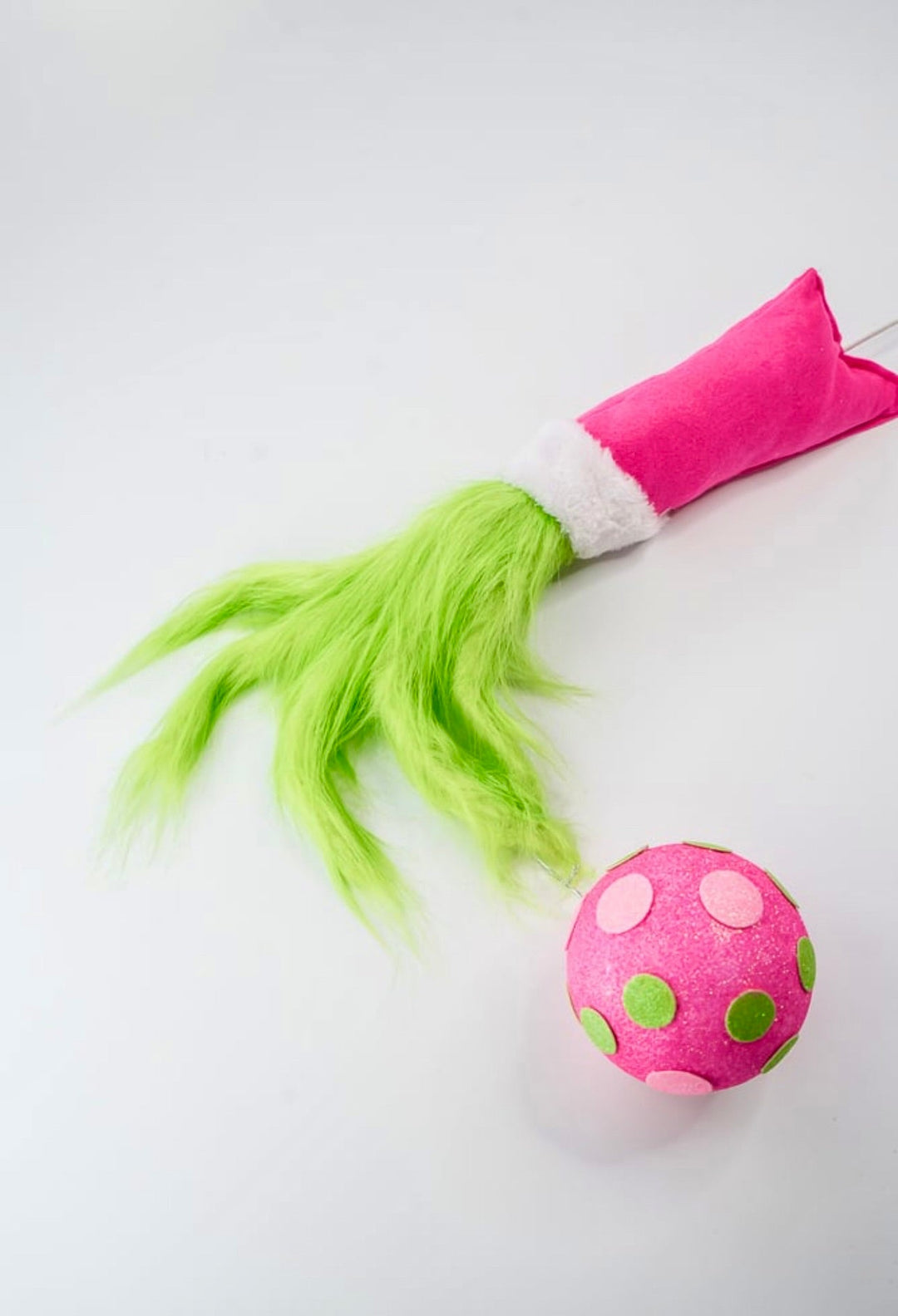 Green fluffy monster hand holding pink ornament - Greenery MarketPicksGM2116PKGN