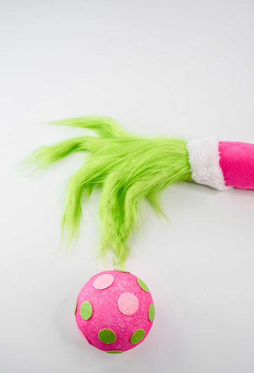 Green fluffy monster hand holding pink ornament - Greenery MarketPicksGM2116PKGN