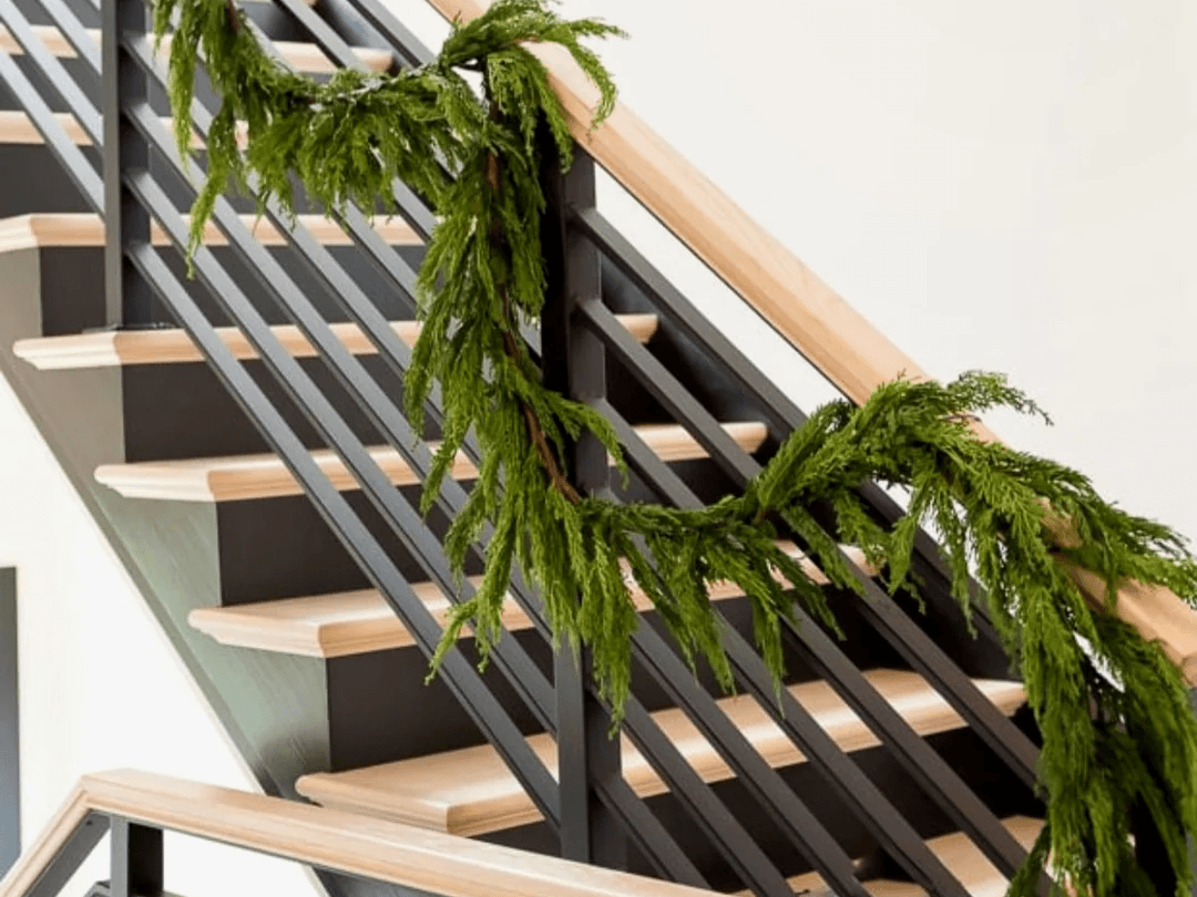 real touch artificial garland draped on stairs