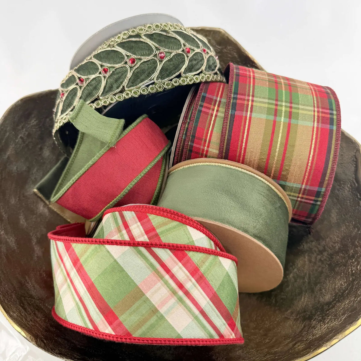 wired red, green, plaid, and jeweled ribbons in a bowl