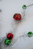 Red and green bells on silver tinsel wired stems - Greenery Market63691